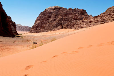 Rock formations in desert against clear sky