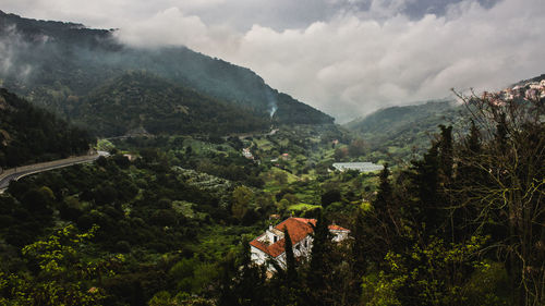 Scenic view of tree mountains against sky