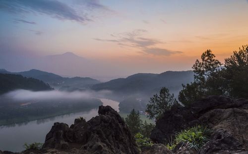 Scenic view of mountains against sky during sunset