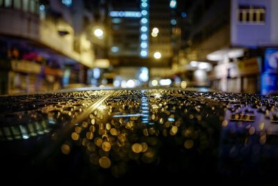 Close-up of droplets on car at night