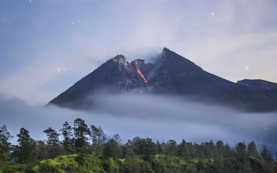 Scenic view of volcanic mountain against sky