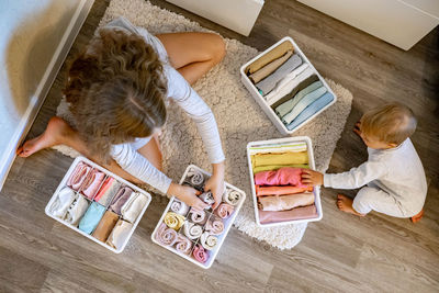 High angle view of girl holding table