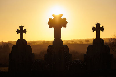 3 crosses during golden sunset backlit