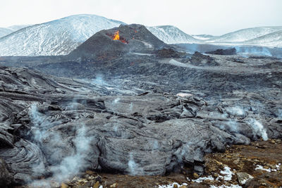 Scenic view of volcanic mountain against sky