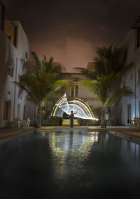 View of swimming pool at night