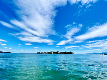 Scenic view of sea against blue sky