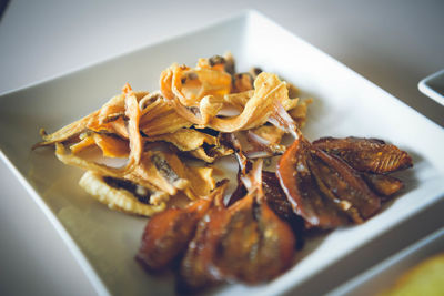 High angle view of meat in plate on table