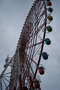 Low angle view of ferris wheel against sky