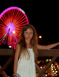 Portrait of woman with illuminated light painting at night