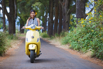 Vietnamese woman with yellow scooter in rural area in vietnam