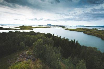Scenic view of sea against cloudy sky