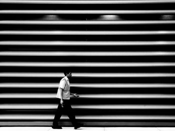 Shadow of man walking on shutter