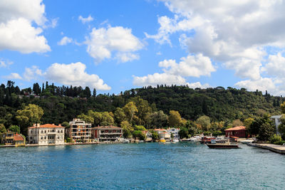 Scenic view of bosporus by buildings against sky