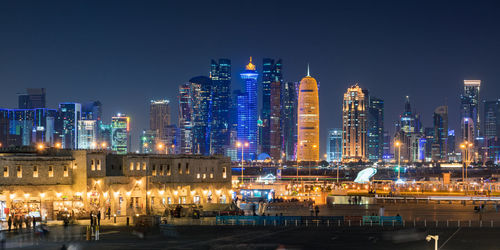 Illuminated buildings in city at night