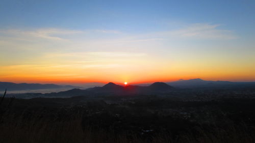 Scenic view of mountains at sunset