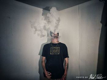 Full length of man smoking against sky