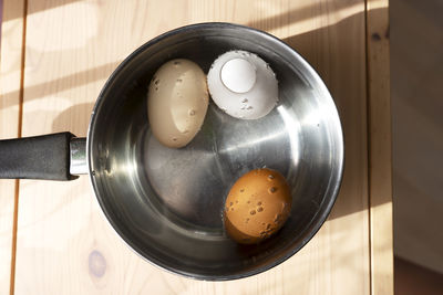 Eggs in a pot with water are ready to cook. boiled eggs. healthy eating.