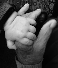 Close-up of hand holding baby