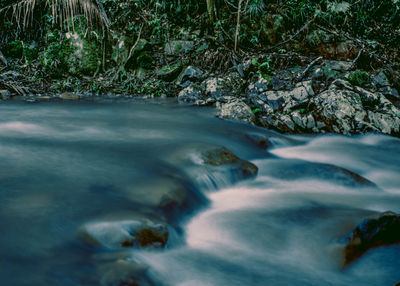 Close-up of water flowing over river