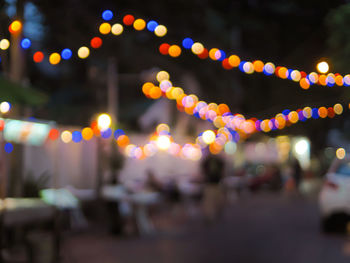 Defocused image of illuminated city at night