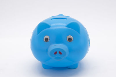 Close-up of blue toy against white background