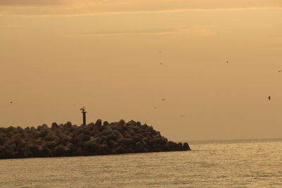 Scenic view of sea against sky during sunset