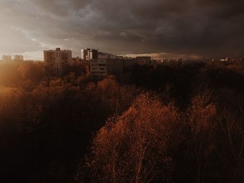 High angle view of buildings against sky at sunset