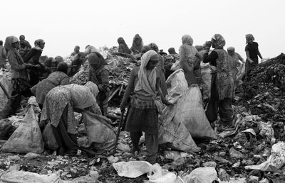 Rear view of people against sky