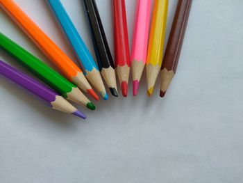 High angle view of multi colored pencils on table