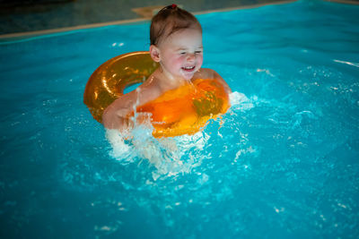 High angle view of boy swimming in pool