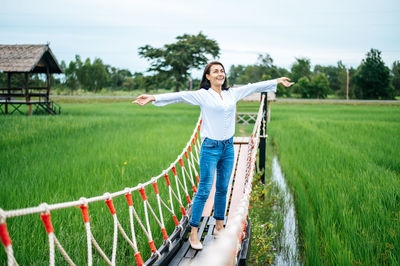 Young woman standing on field