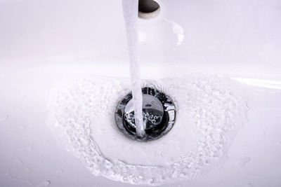 High angle view of faucet in bathroom at home