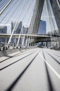 View of road against suspension bridge