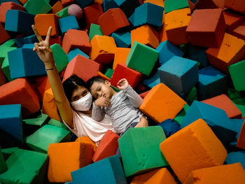 Portrait of mother with son in lying on sponges