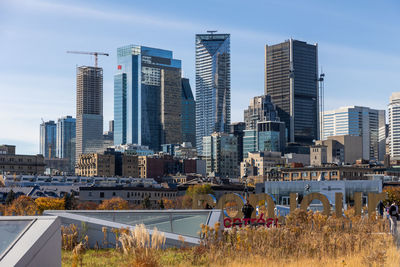 Buildings in city against sky