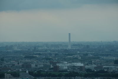 High angle view of buildings in city against sky