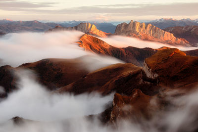 Scenic view of mountains against cloudy sky