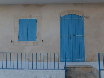 Closed blue door of building