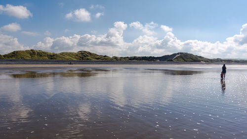 Scenic view of beach against sky