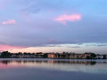Scenic view of lake against sky at sunset