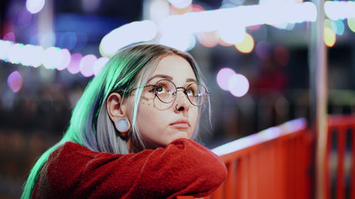 Close-up of young woman looking away