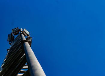 Low angle view of tower against clear blue sky