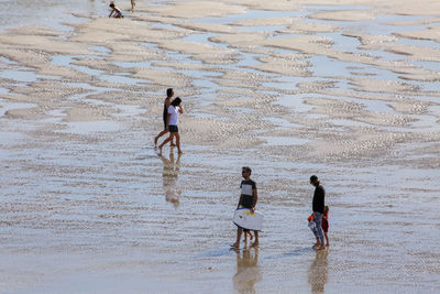 People walking on beach