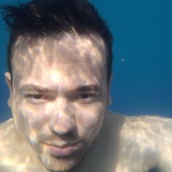 Portrait of young man in swimming pool