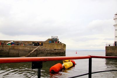 Low angle view of man in sea against sky