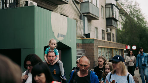 Group of people in front of building