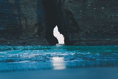 Reflection of rock in sea