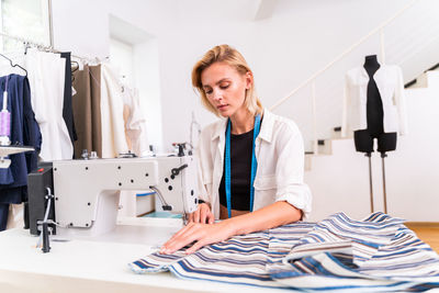 Female fashion designer working at studio