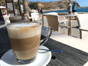 Close-up of coffee cup on table