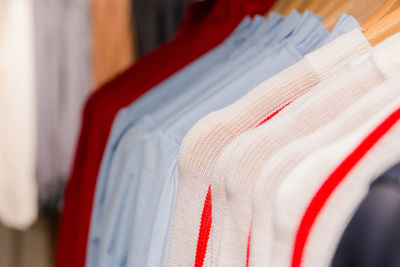 Close-up of clothes hanging on rack in store